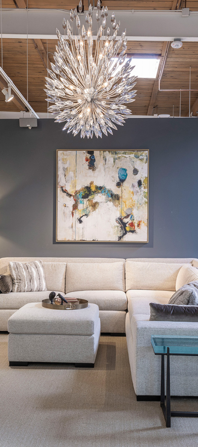 white couch with beautiful modern chandelier